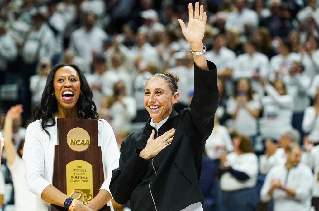 Diana Taurasi waves to the crowd of UConn fans at Gampel Pavilion