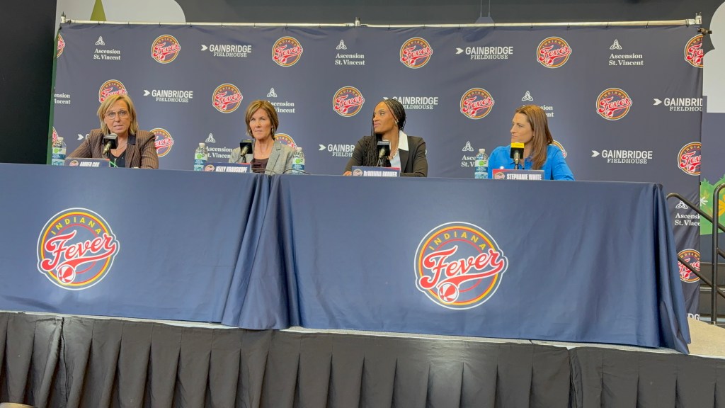 Amber Cox, Kelly Krauskopf, DeWanna Bonner and Stephanie White sit at a press conference.