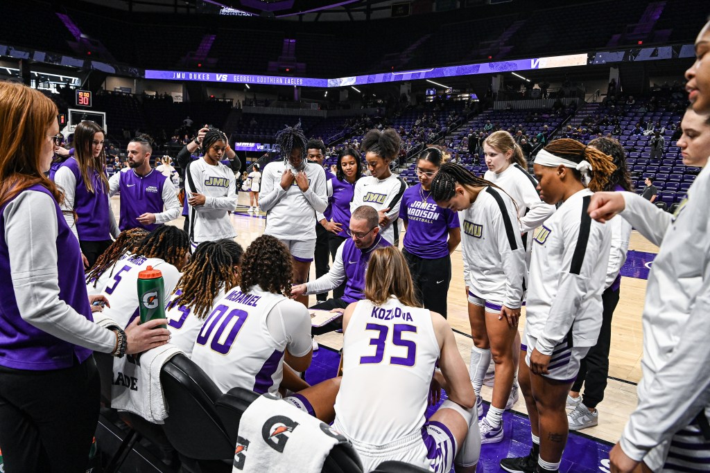 James Madison team huddle during a game against Georgia Southern. (Photo credit: James Madison Athletics)