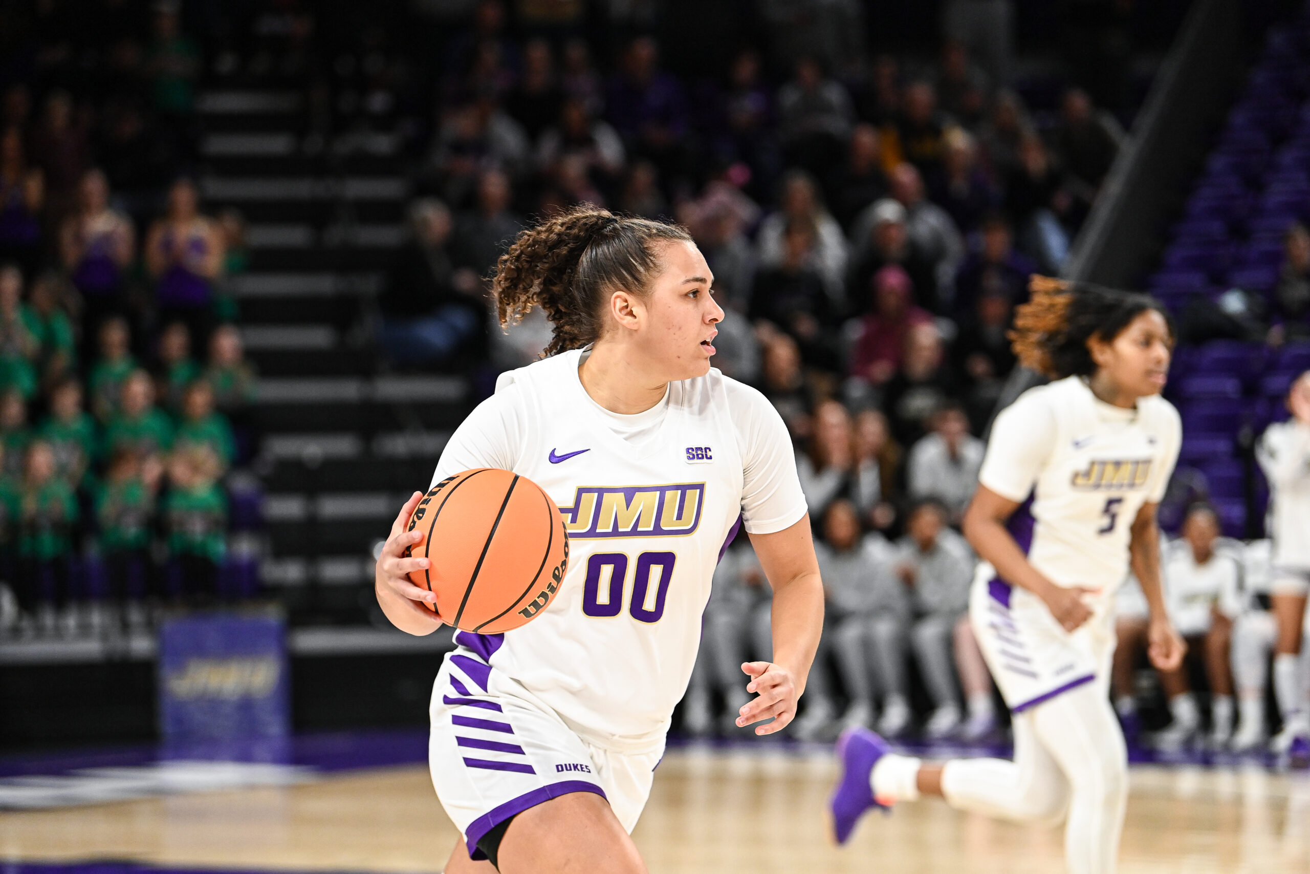 James Madison's Peyton Williams brings the ball up the floor in a game against Ball State. (Photo credit: James Madison Athletics)