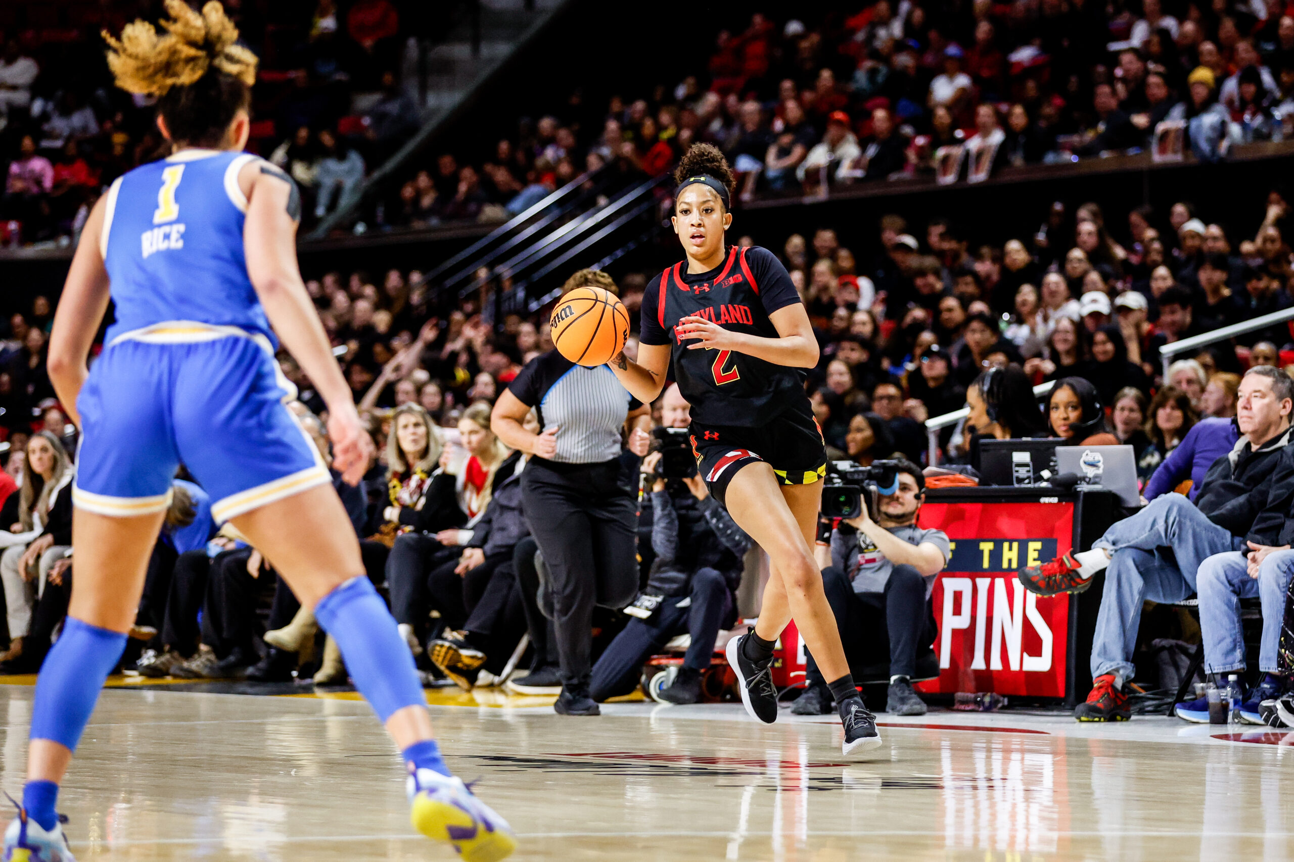 Maryland guard Kaylene Smikle brings the ball up the floor against UCLA. (Photo credit: University of Maryland Athletics)