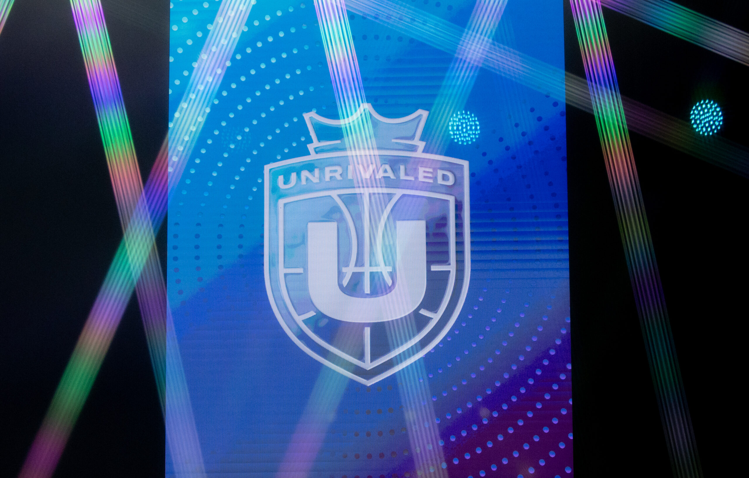 The Unrivaled logo on a blue background