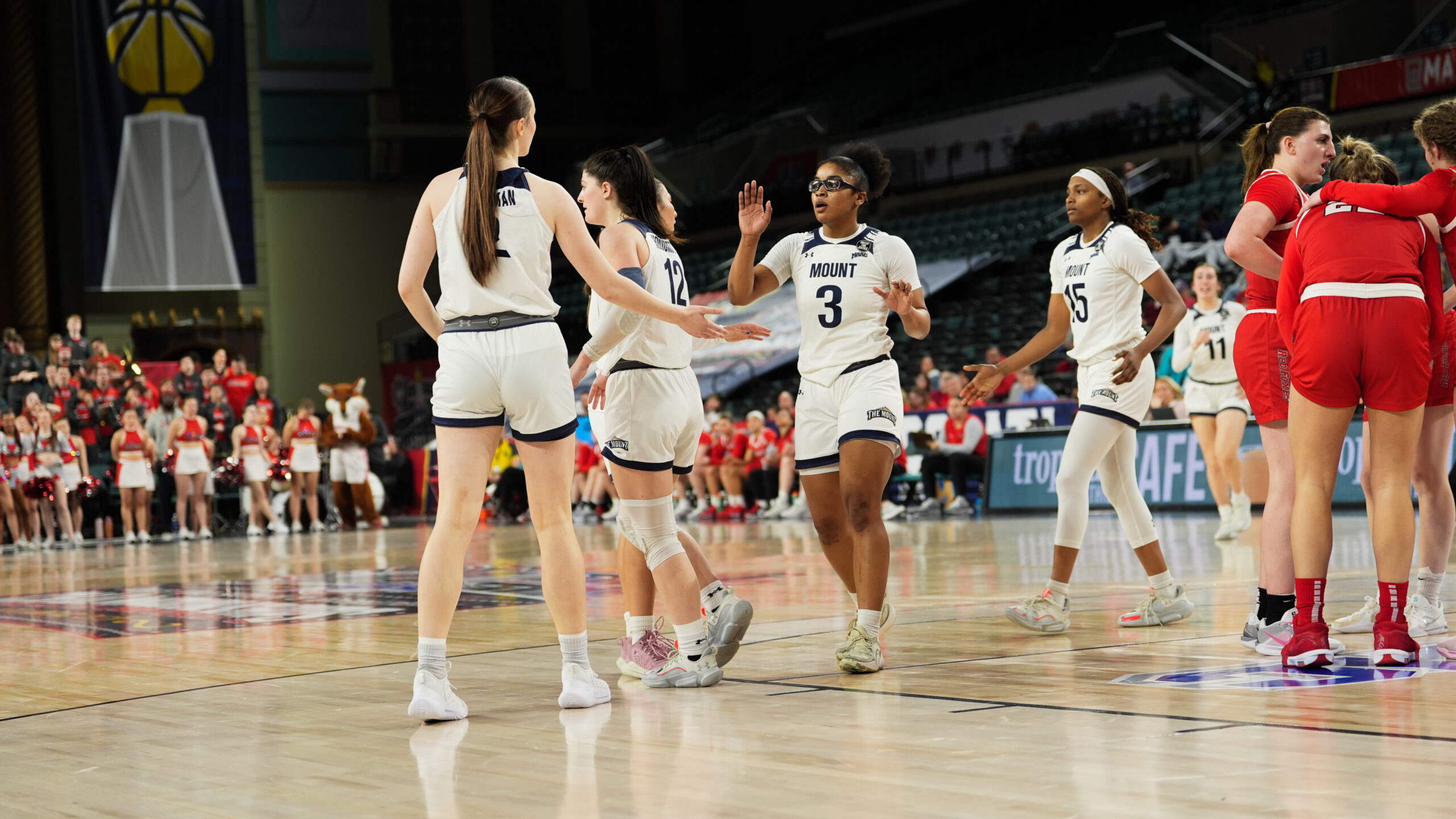 Freshman guard Madison Ruff high fives her teammates on the court of Jim Whelan Boardwalk Hall during the MAAC Tournament (Photo credit: Michelle Quaglia).