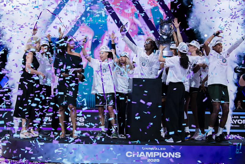 Rose BC players celebrate amid the confetti.