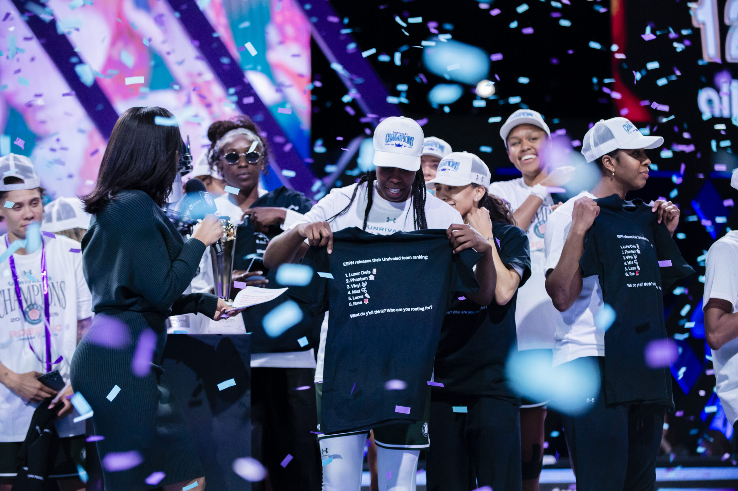 Chelsea Gray receives the Unrivaled League Finals MVP award as confetti falls.