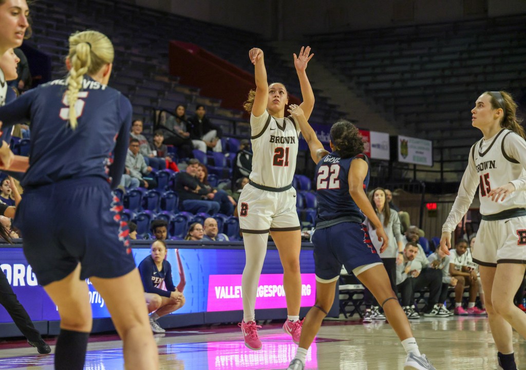 Brown guard Grace Arnolie follows through on a jump shot and watches the flight of the ball.