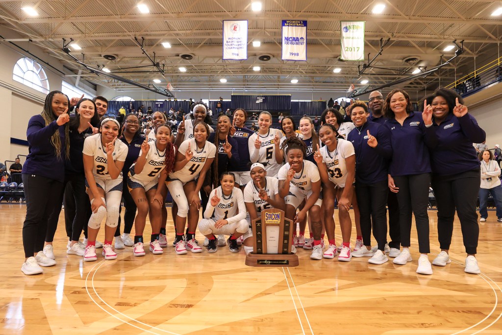 UNC Greensboro celebrates its SoCon regular season championship after beating Western Carolina. (Photo credit: Carlos Morales | UNCG Athletics)