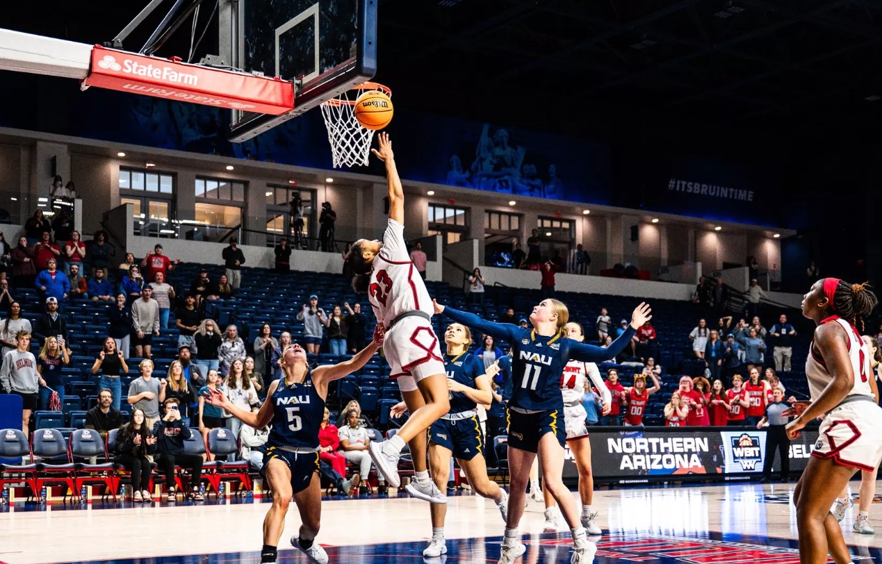 Belmont guard Jailyn Banks (23) scores winning shot against Northern Arizona.