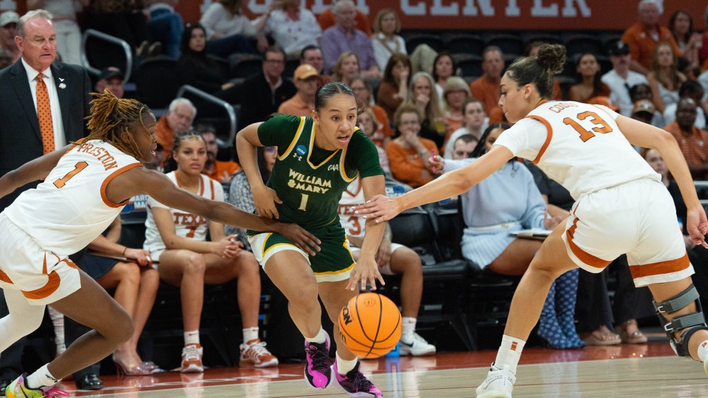 William & Mary guard Cassidy Geddes dribbles between a pair of Texas defenders in the NCAA Tournament. (Photo credit: William & Mary Athletics)