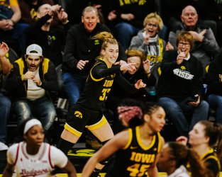 Lucy Olsen (33) scores for the Iowa Hawkeyes.