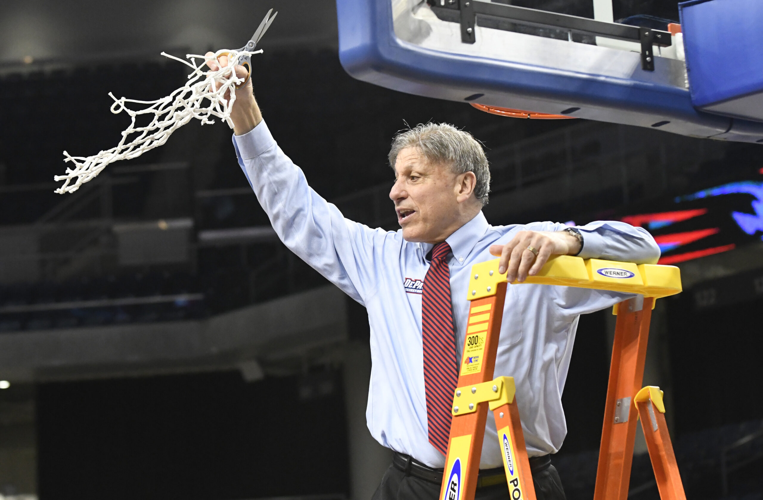 Doug Bruno cuts down the net following a conference tournament championship
