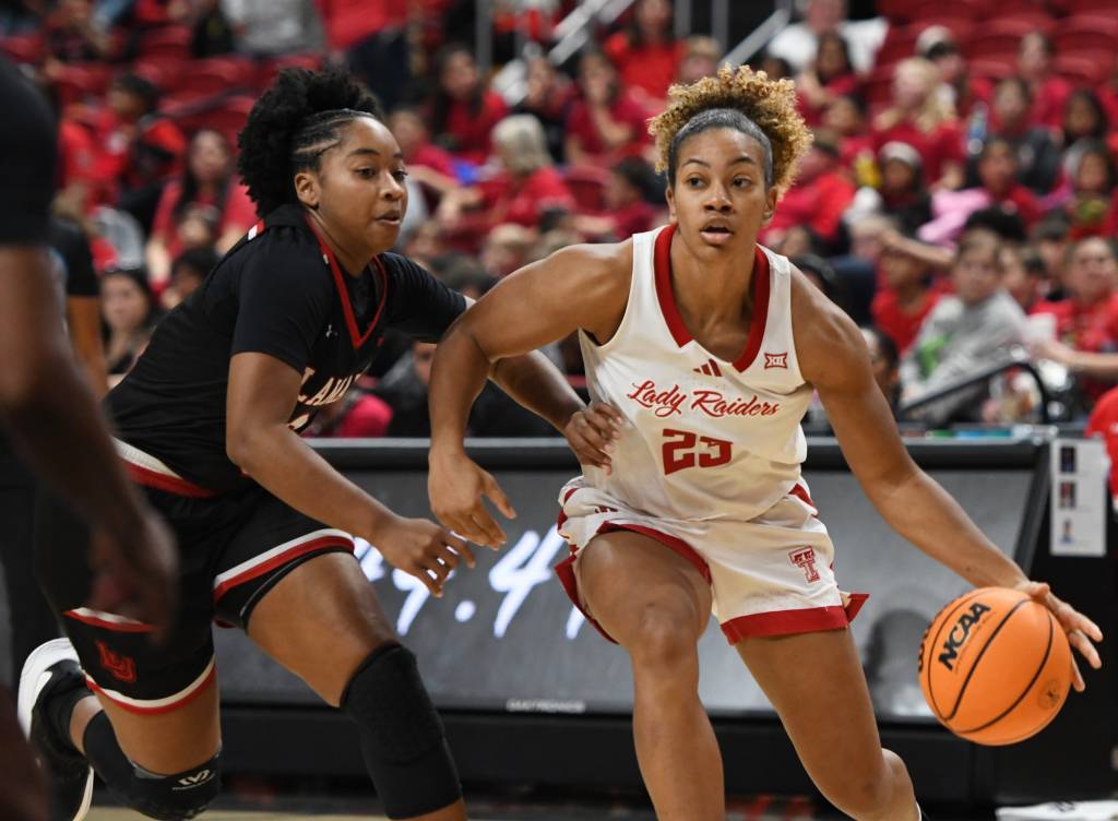 Texas Tech's Loghan Johnson dribbles against a Lamar defender