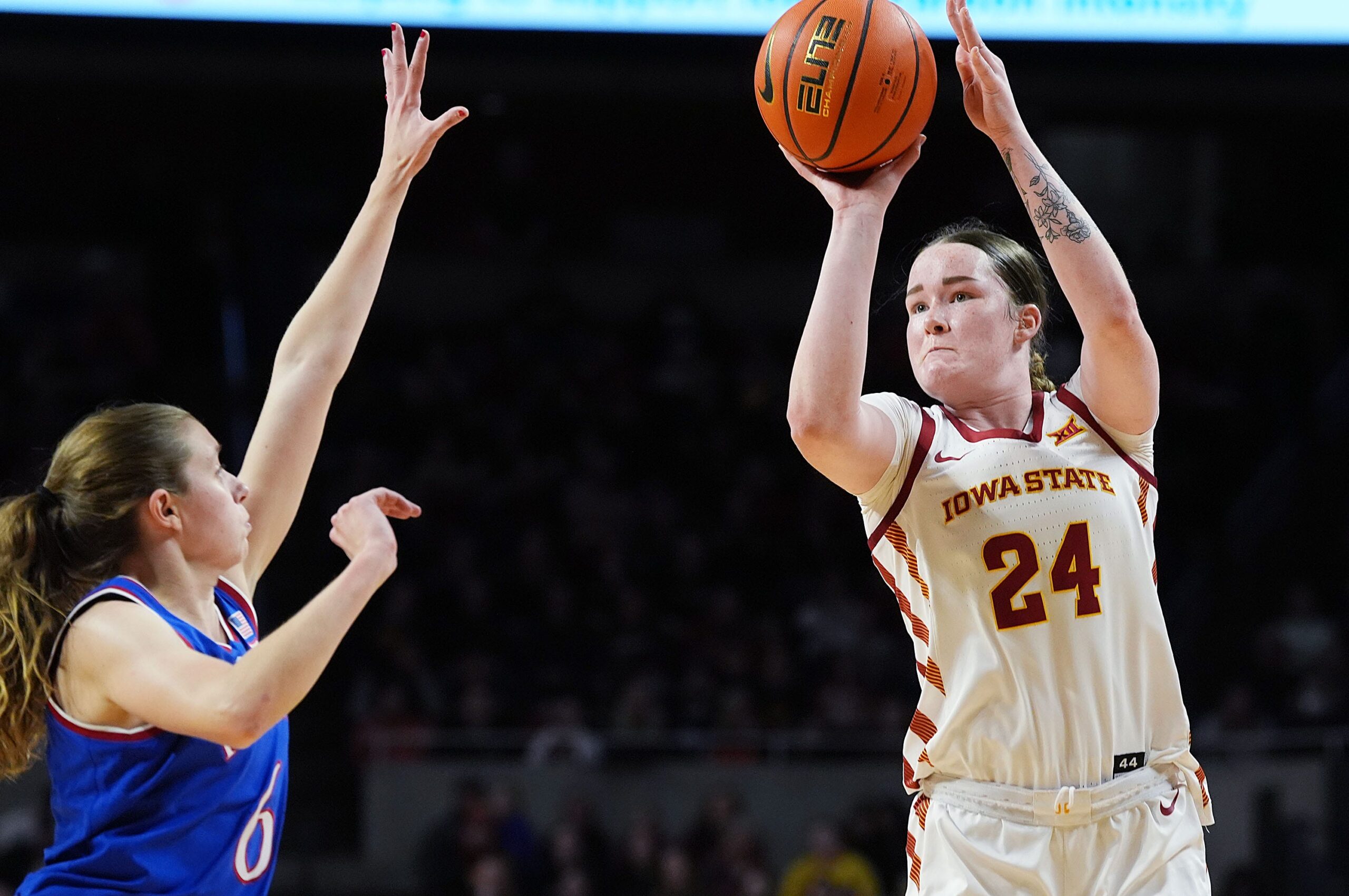 Iowa State Cyclones' forward Addy Brown (24) shoots the ball over Kansas Jayhawks' guard Laia Conesa (6)