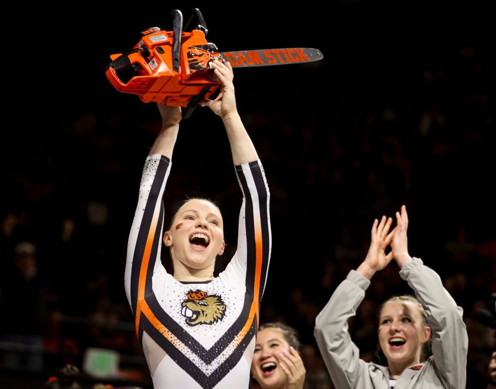 Jade Carey celebrates a perfect 10 on beam with a...chainsaw? Sure.