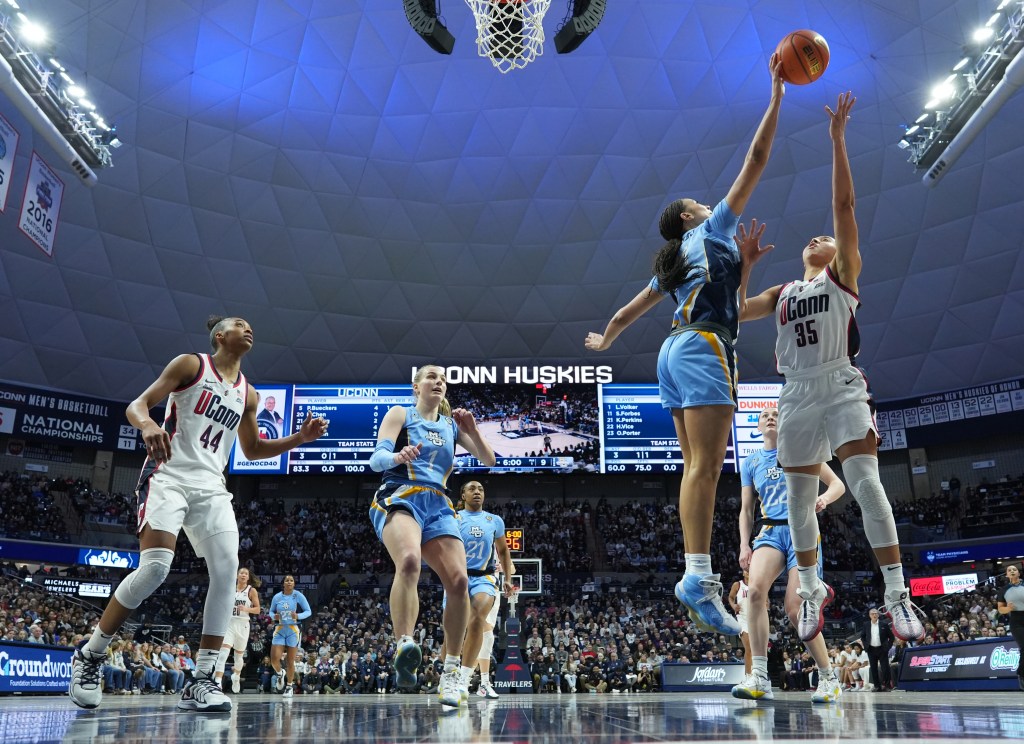 Skylar Forbes jumps high for a block
