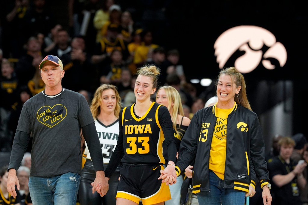 Lucy Olsen with her family at Senior Day in Iowa City, Iowa.