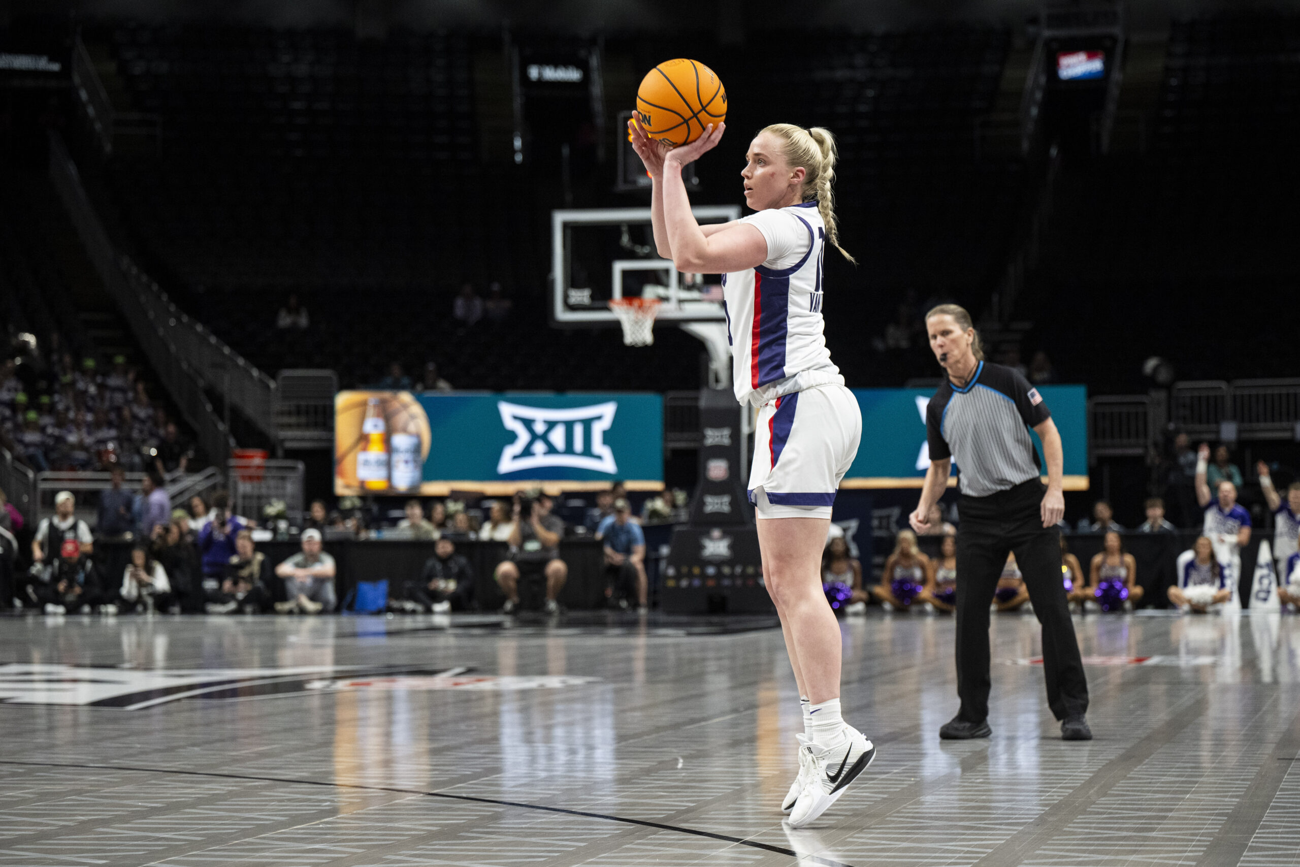 TCU guard Hailey Van Lith shoots a 3-pointer. No defenders are in the frame to contest the shot.