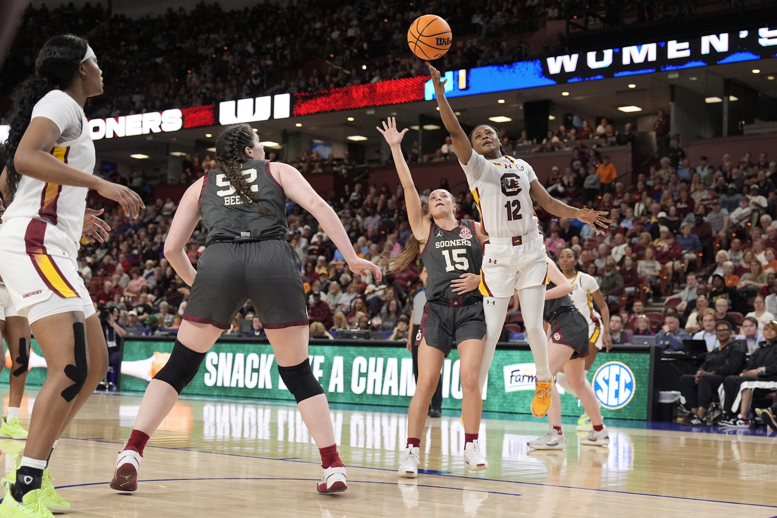 South Carolina guard MiLaysia Fulwiley releases a shot with her right hand after getting an angle on Oklahoma guard Lexy Keys and leaning past her.