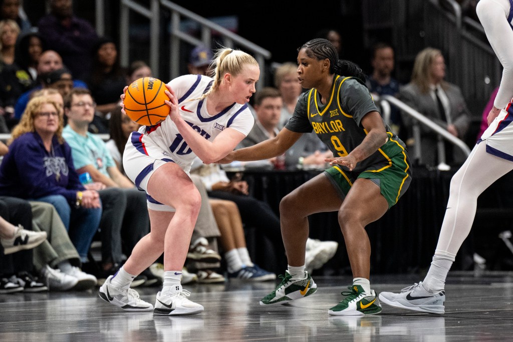 TCU Horned Frogs guard Hailey Van Lith is in triple threat while being defended by Baylor Bears guard Aliyah Matharu (9)