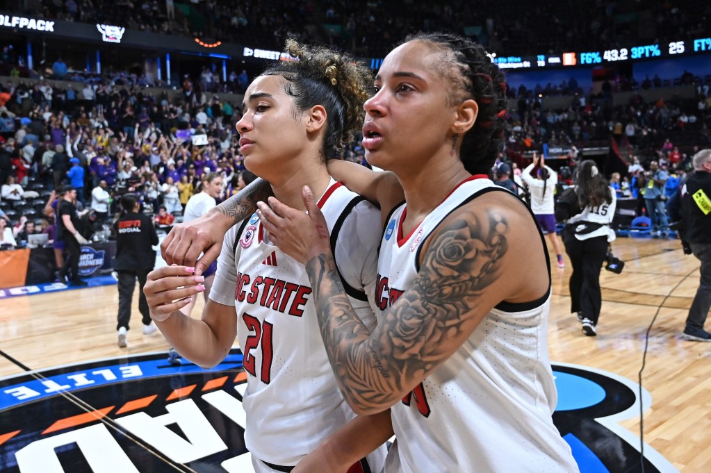 NC State Wolfpack guards Madison Hayes (21) and Aziaha James (10) walk off the court embracing each other with tears in their eyes after their Sweet 16 NCAA Tournament loss to LSU Lat Spokane Arena in Spokane, Wash. on March 28, 2025.