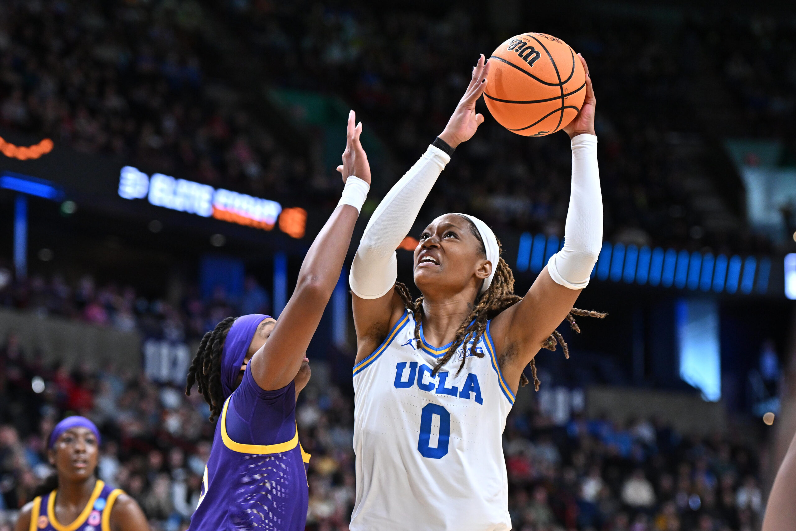 UCLA Bruins forward Janiah Barker (0) shoots against LSU Lady Tigers forward Sa'Myah Smith (5) during the first half of a Elite 8 NCAA Tournament basketball game at Spokane Arena.