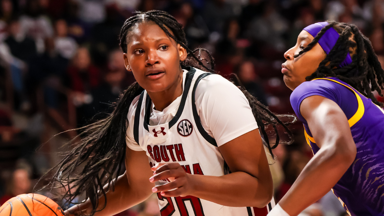 Jan 24, 2025; Columbia, South Carolina, USA; South Carolina Gamecocks forward Sania Feagin (20) drives around LSU Lady Tigers forward Sa'Myah Smith (5) in the first half at Colonial Life Arena. (Photo credit: Jeff Blake, Imagn Images)