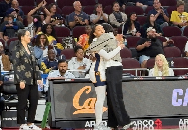Cal head coach Charmin Smith embraces sophomore Lulu Twidale at the end of the Bears' first-round NCAA game against Mississippi State in Los Angeles.