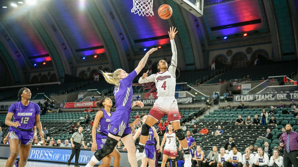 Rider's Stella Johnson (4) attempts a layup with her left hand while defended by a Niagara player in the first round of the 2020 MAAC Tournament in Atlantic City, N.J. (Photo Credit: Pete Borg)