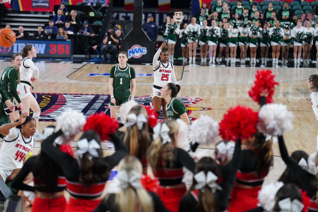 Fairfield junior guard Sydni Scott holds up three fingers on her right hand following a made three pointer in the Stags 59-51 MAAC Tournament win over Manhattan Wednesday afternoon. (Photo credit: Olivia Frzop).