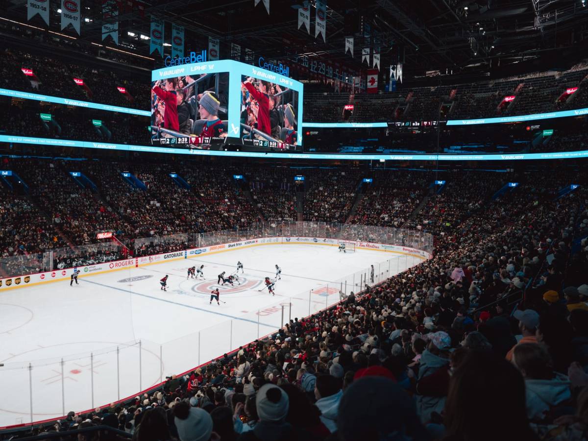 A wide angle shot of the crowd and ice at the Bell Centre as Boston and Montréal prepare for a center ice faceoff.