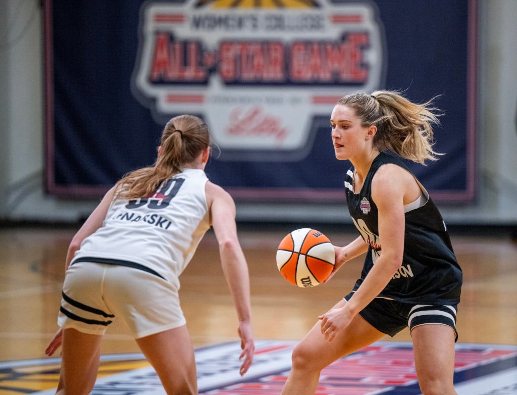 Columbia guard Kitty Henderson dribbles the ball with her right hand as North Carolina guard Lexi Donarski defends her in a scrimmage.