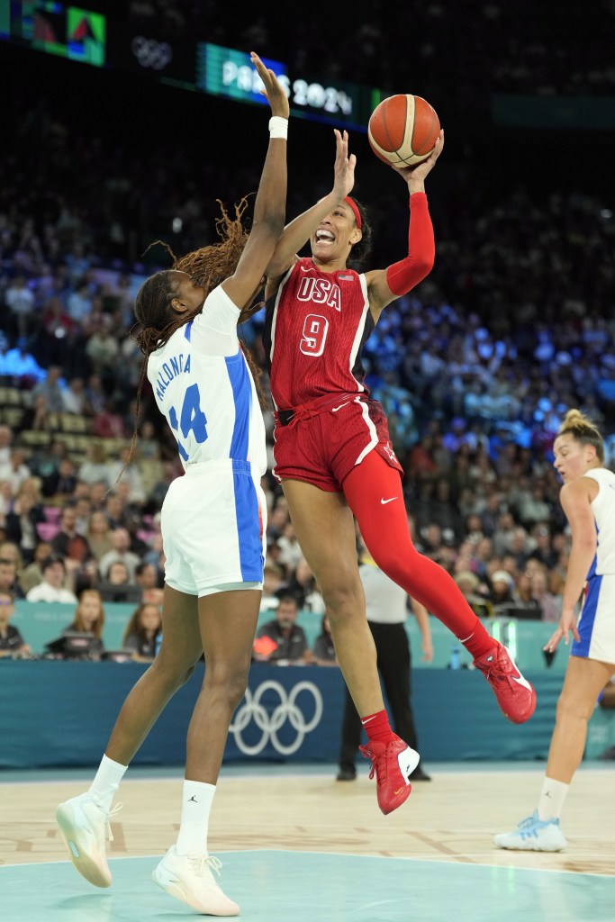 United States forward A'Ja Wilson (9) shoots against France centre Dominique Malonga (14) in the first half in the women's gold medal game during the Paris 2024 Olympic Summer Games at Accor Arena in Paris, France on August 11, 2024.