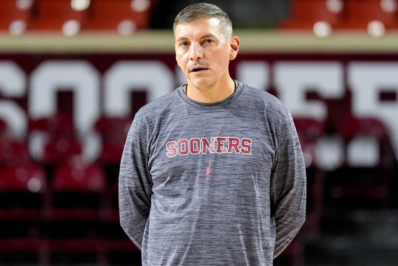 Oklahoma women's basketball associate head coach Jonas Chatterton stands courtside at a Sooners' practice session in Norman, Okla.