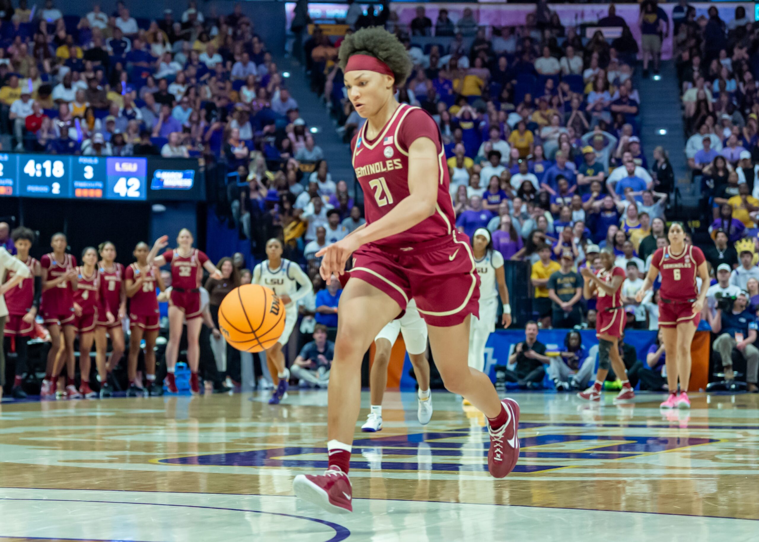 Florida State forward Makayla Timpson dribbles the ball up the floor.