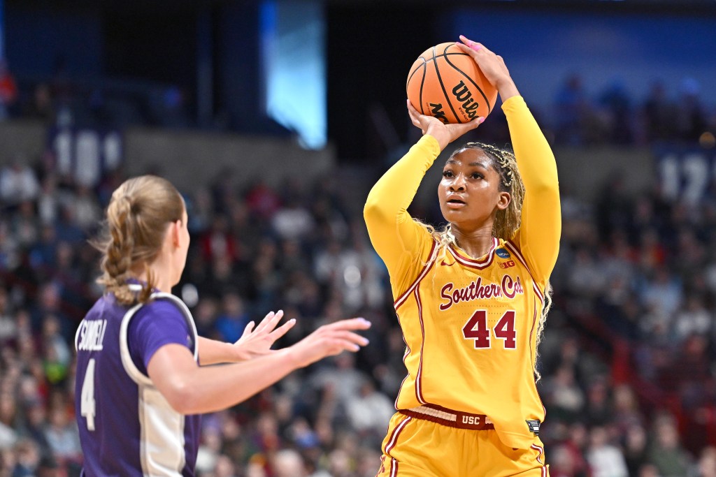 USC forward Kiki Iriafen takes an open jump shot as Kansas State guard Serena Sundell can't get a hand up to contest it.