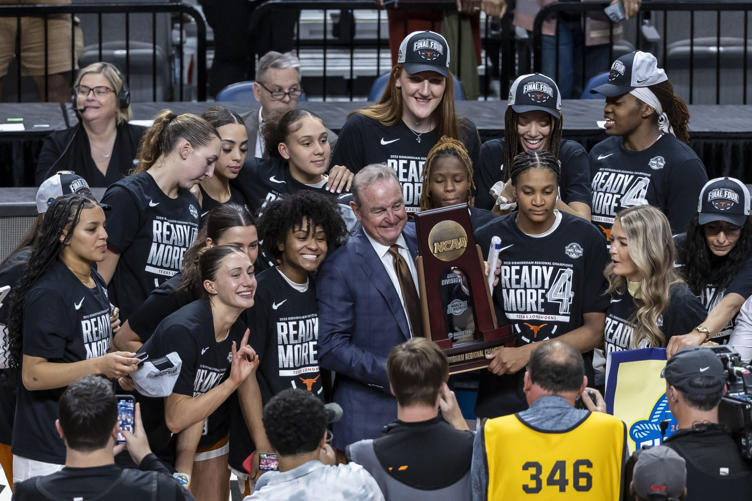 Vic Schaefer holds a trophy.