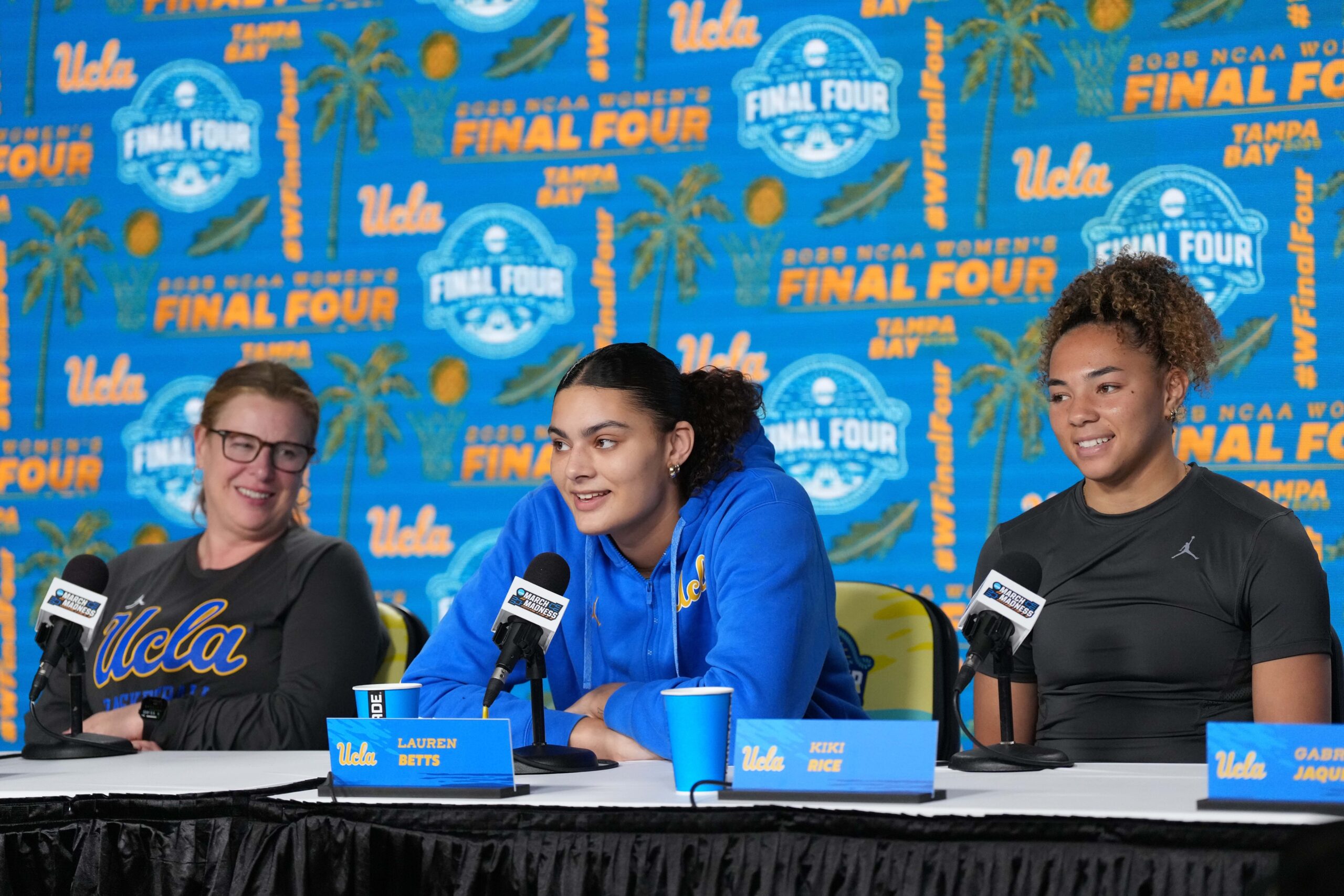 UCLA Bruins head coach Cori Close (left), center Lauren Betts (center) and guard Kiki Rice during press conference at Amalie Arena in Tampa, Fla. on April 3, 2025.