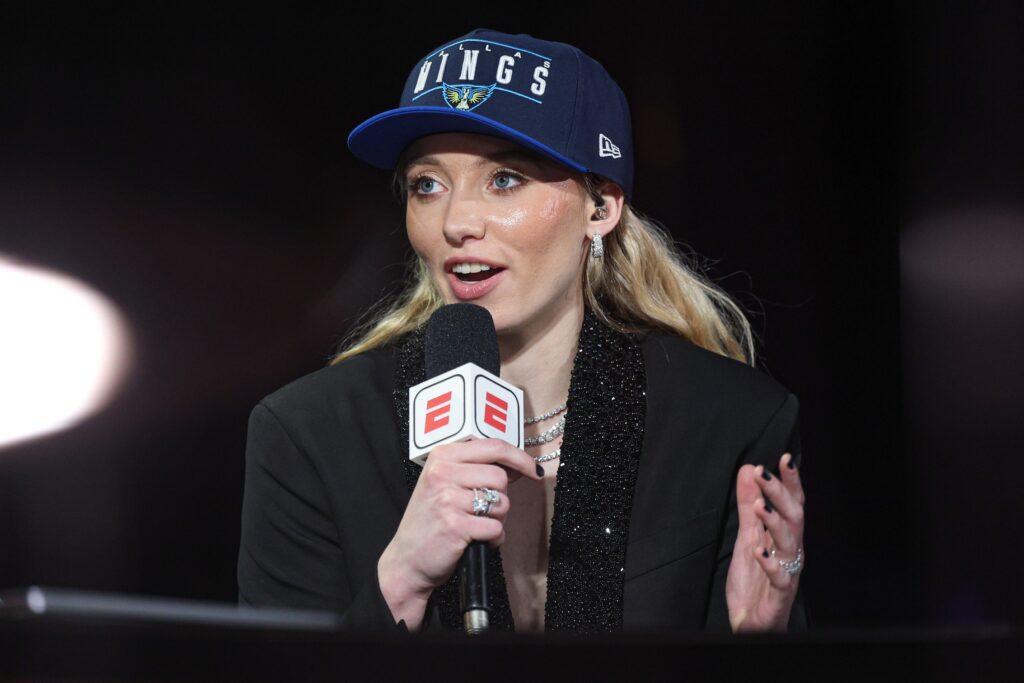 Paige Bueckers at the microphone.