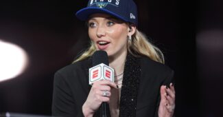 Paige Bueckers at the microphone.