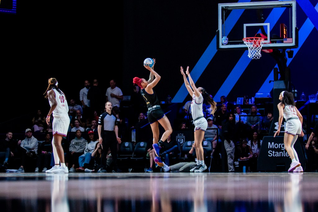 Lunar Owls BC forward/center Shakira Austin leans back and to her left as she shoots a fadeaway layup during Unrivaled play.