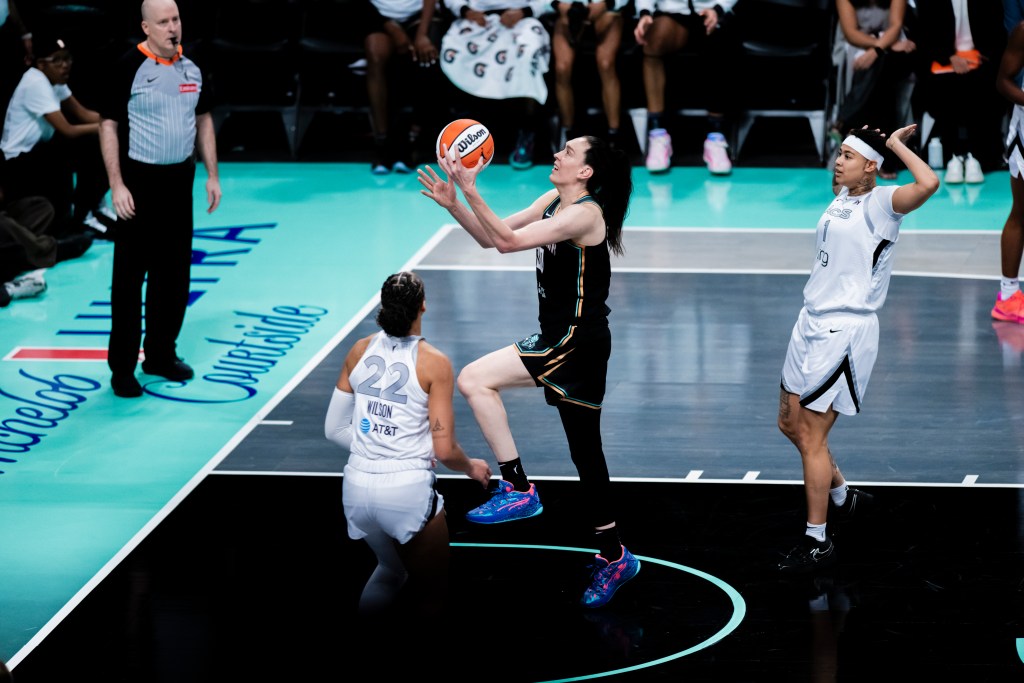 Breanna Stewart lays up the basketball while <a rel=