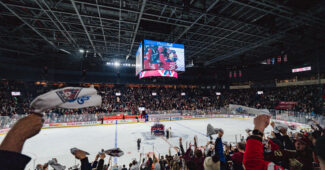 Montréal Victoire celebrate on the ice following a PWHL playoff game