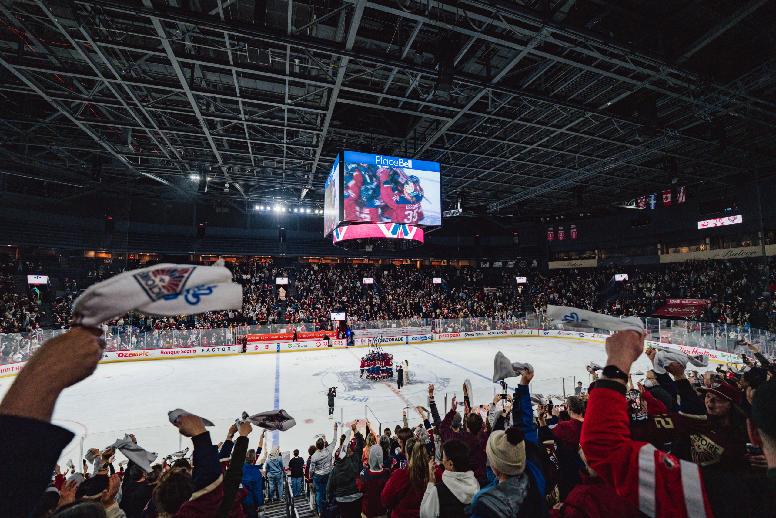 Montréal Victoire celebrate on the ice following a PWHL playoff game