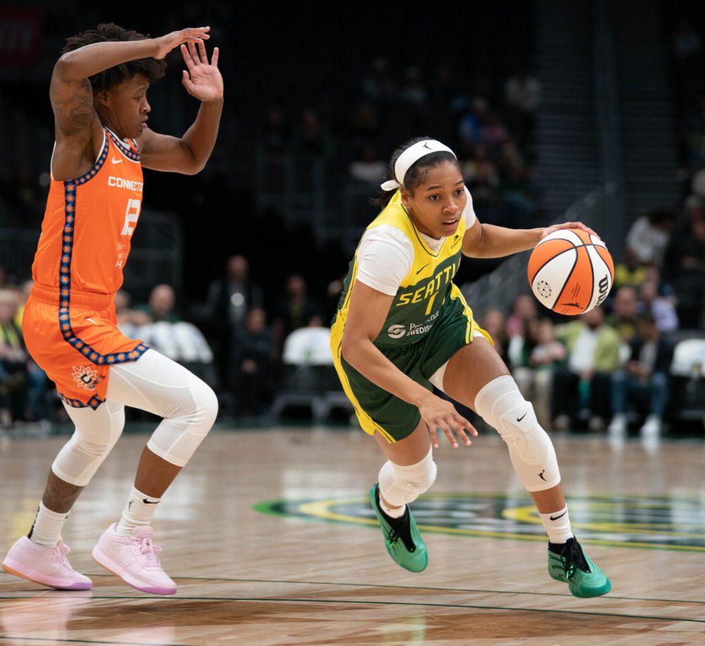 Seattle Storm guard Zia Cooke drives with the ball against a Connecticut Sun defender in a preseason matchup on May 4, 2025 at Climate Pledge Arena in Seattle, Wash.