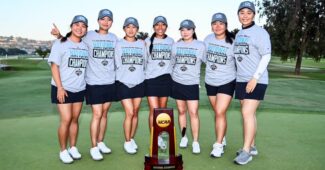 The Northwestern women's golf team poses for a photo behind the National Championship trophy.