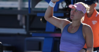 Peyton Stearns acknowledges the crowd with a fist in the air.