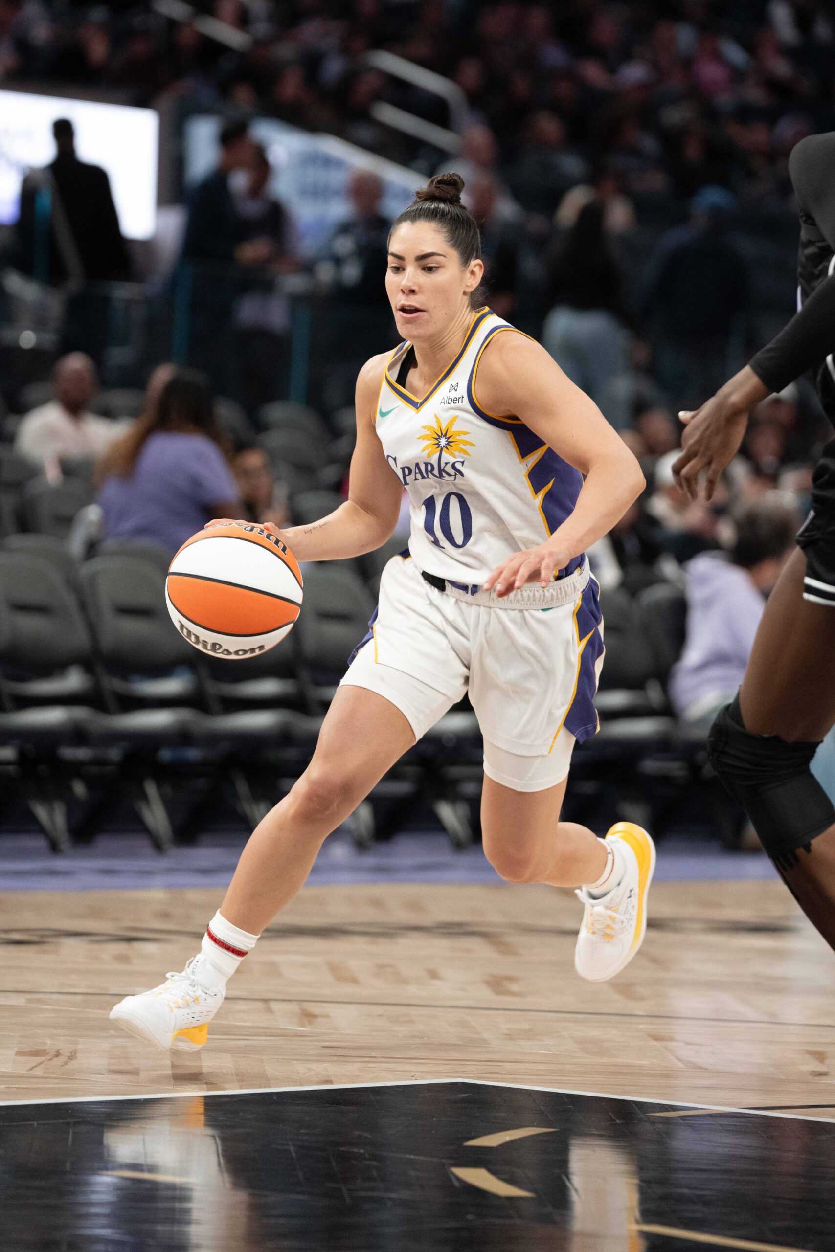 Kelsey Plum drives to the basket in the preseason game between the Los Angeles Sparks and the Golden State Valkyries.