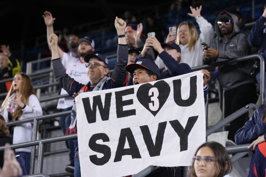 May 17, 2025; San Jose, California, USA; A fan of Bay FC holds up a sign in support of Angel City FC defender Savy King (3) after the game at PayPal Park. Mandatory Credit: Darren Yamashita-Imagn Images
