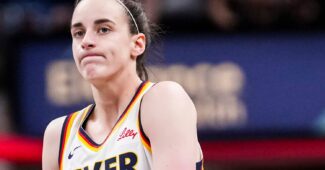 Caitlin Clark shrugs.