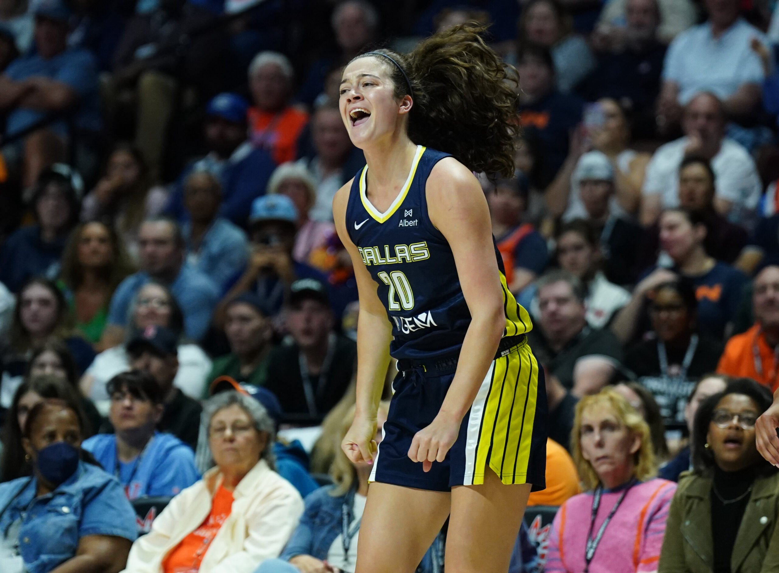 Dallas Wings forward Maddy Siegrist celebrates after hitting a three-pointer.
